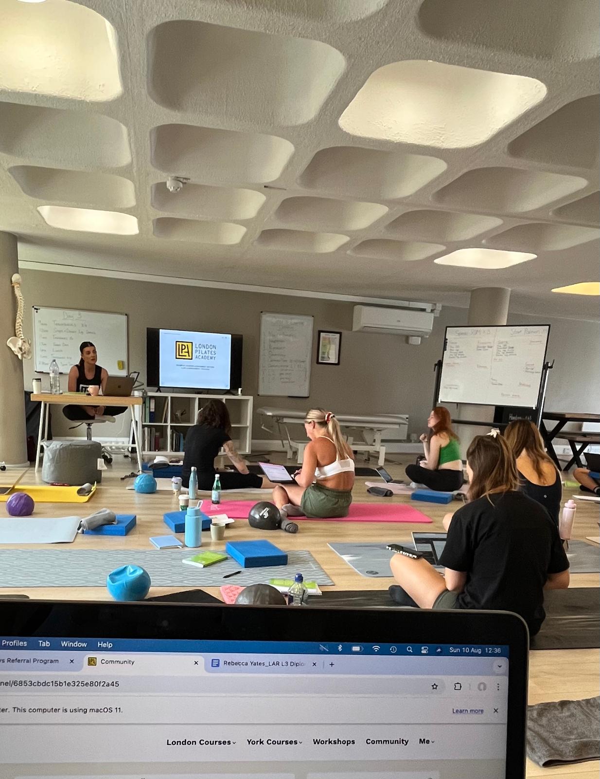 Becky Yates teaching Pilates training class at London Pilates Academy